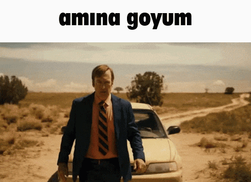 a man in a suit and tie stands in front of a car with the words amina goyum written above him