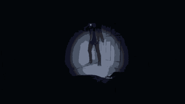 a close up of a person 's hands holding a knife in the dark
