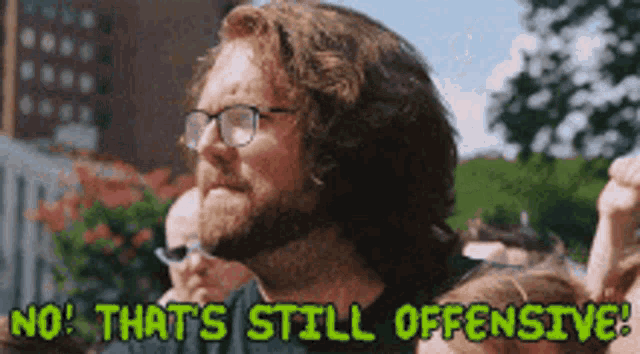 a man with a beard and glasses says no that 's still offensive