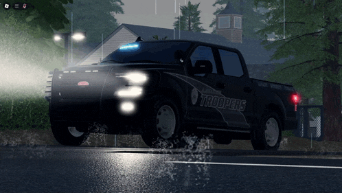 a black truck with troopers written on the side