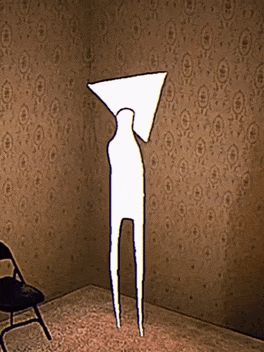 a chair in a corner of a room with a light coming out of the wall