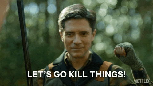 a man is holding a shotgun and saying `` let 's go kill things '' .