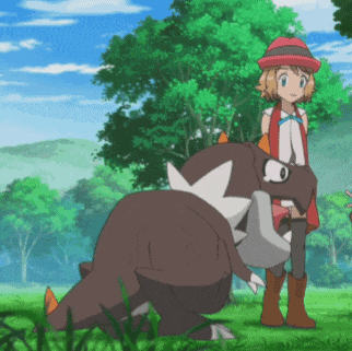 a girl in a red hat is standing next to a brown dinosaur
