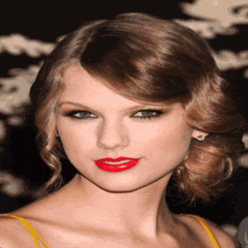 a close up of a woman 's face with red lipstick on