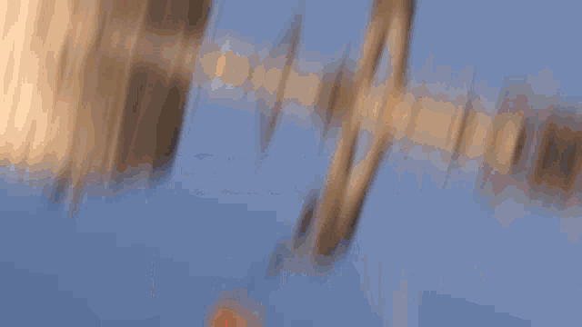 a blurred image of a person standing next to a can of soda