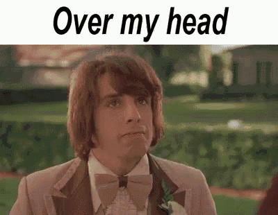 a man in a suit and bow tie is standing in a field with the words `` over my head '' above him .