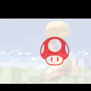 a red mushroom with a hole in the middle is floating in the air .