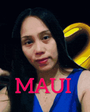 a woman in a blue dress with the word maui written on it