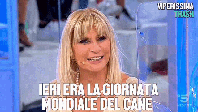 a woman is smiling with the words ieri era la giornata mondiale del cane written below her