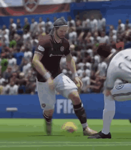 a soccer player wearing a number 1 jersey kicks a ball