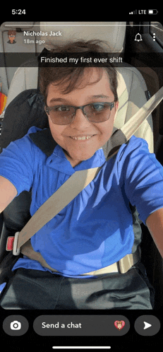 a young boy is sitting in a car seat and taking a selfie with the caption nicholas jack 18m ago