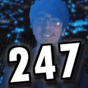 a man with glasses is smiling in front of a number 247