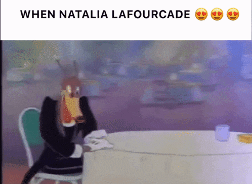 a cartoon of a cat sitting at a table with the words when natalia lafourcade above it