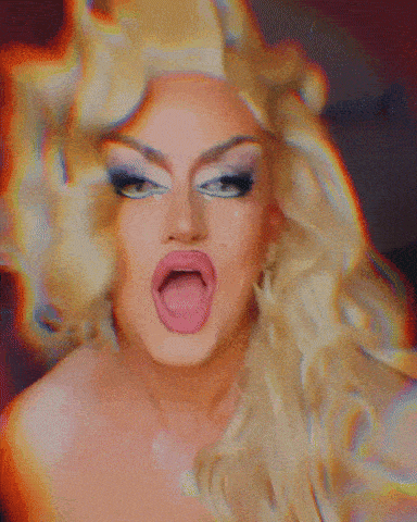 a close up of a woman with blonde hair making a funny face