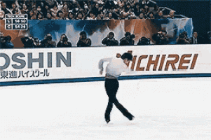 a man is skating in front of a sign that says ichirei on it