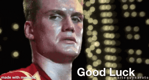 a man in a red shirt with the words good luck on the bottom