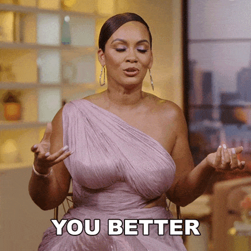 a woman in a purple dress is saying " you better "