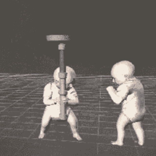 a group of babies are playing with a hammer on a tiled floor