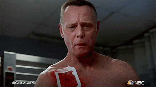 a shirtless man with a bandage on his chest has the hashtag #chicagopd on the bottom