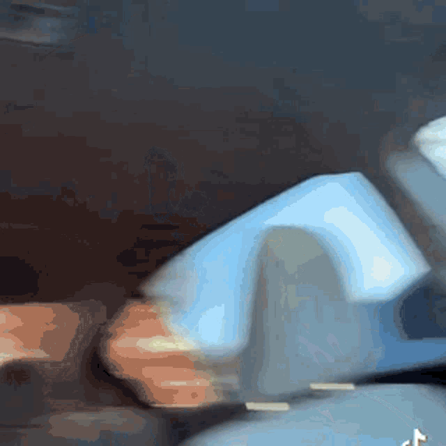 a blurred image of a person holding a piece of paper