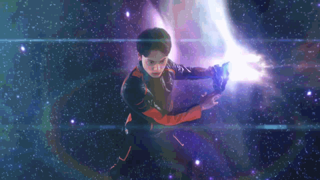 a man in a space suit is holding a purple object