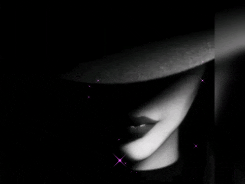 a black and white photo of a woman wearing a hat with the name meryem written on it