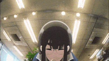 a girl with long black hair and glasses is sitting in a room with a lot of lights