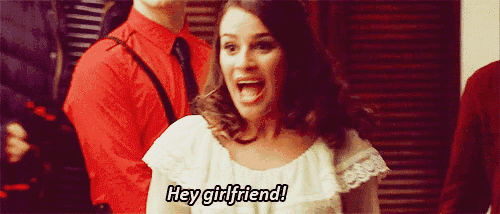 a woman in a white dress is screaming and says hey girlfriend