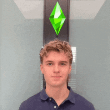 a young man with his eyes closed stands in front of a green diamond
