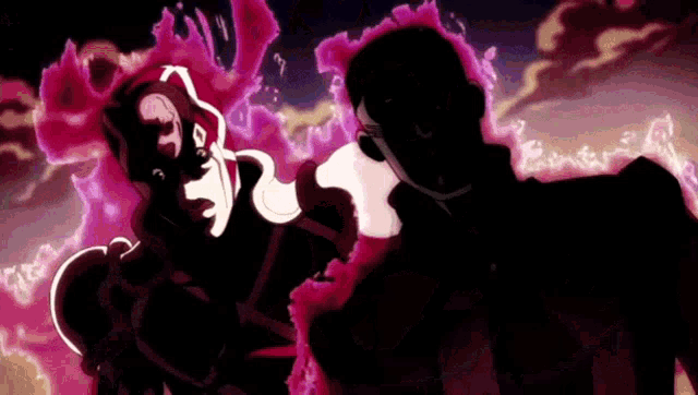 a man and a woman are standing next to each other in a dark room with a purple background .