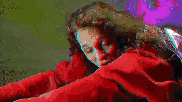 a person is jumping in front of a television