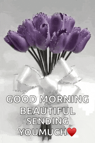 a bouquet of purple flowers in a white vase with a bow and the words good morning beautiful sending you much