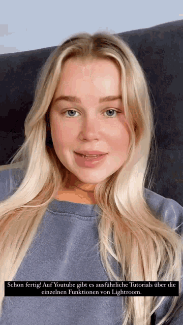 a woman with blonde hair is sitting on a couch with a caption that says schon fertig