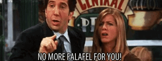 a man and a woman are standing next to each other and the woman is saying no more falafel for you