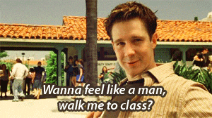 a man says " wanna feel like a man walk me to class " in front of a building