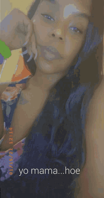 a woman with long hair is taking a selfie and the caption says yo mama ... hoe