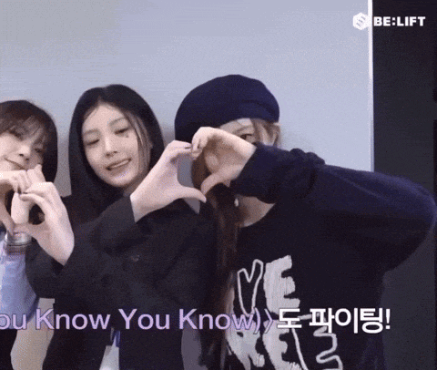 three girls are making a heart shape with their hands and the words you know you know
