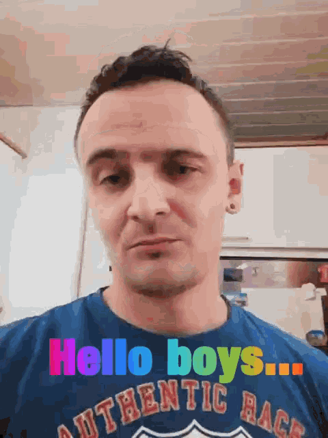 a man wearing a blue shirt that says authentic race on it