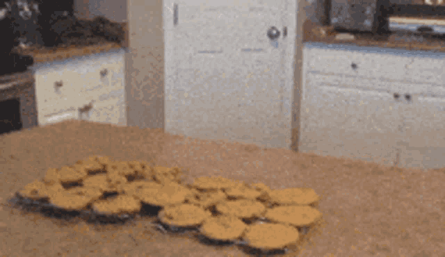 a kitchen counter with a bunch of cookies on it