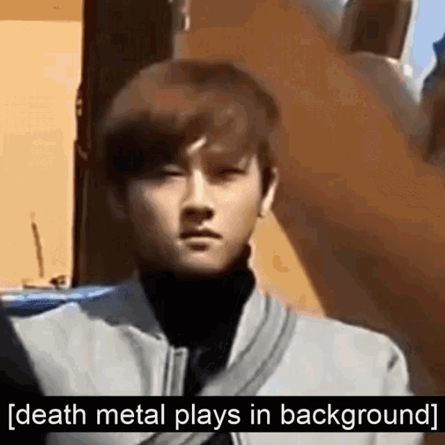 a young man is standing in front of a building with the words `` death metal plays in background '' written on the bottom .