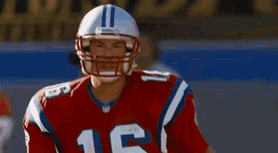 a football player wearing a helmet with the number 16 on it