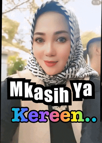 a woman wearing a scarf with the words mkasih ya kereen written on it