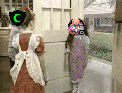 two little girls are standing next to each other in front of a door with a c on it .