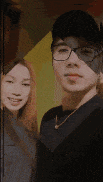 a man and a woman are posing for a picture together