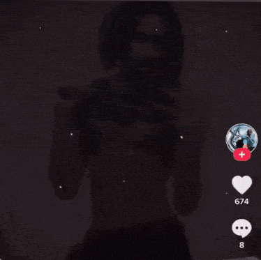 a shirtless man is taking a selfie with his cell phone