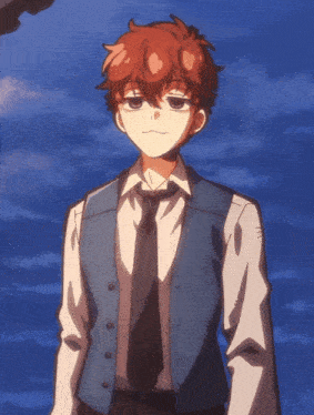 a boy with red hair is wearing a blue vest and black tie