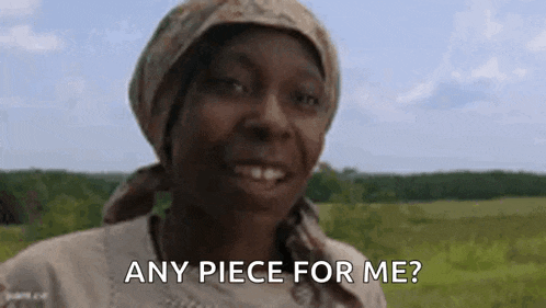 a woman in a head scarf is smiling and asking for a piece of meat .