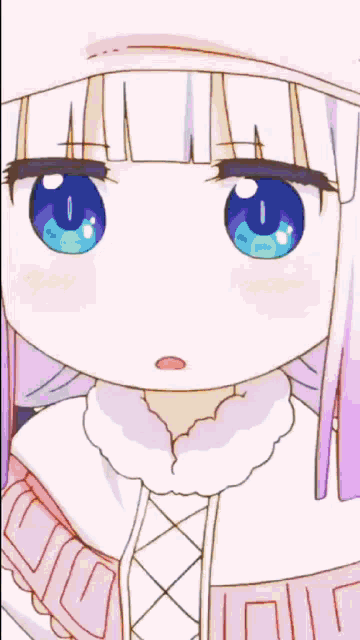 a girl with blue eyes is sitting at a table with a glass of orange juice in front of her
