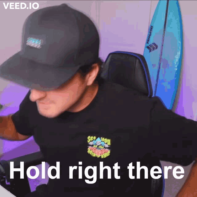 a man wearing a black shirt that says see you on the front