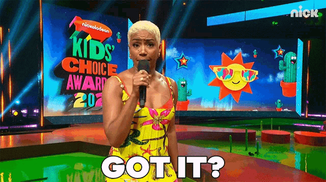 a woman speaking into a microphone at a nickelodeon kids choice awards